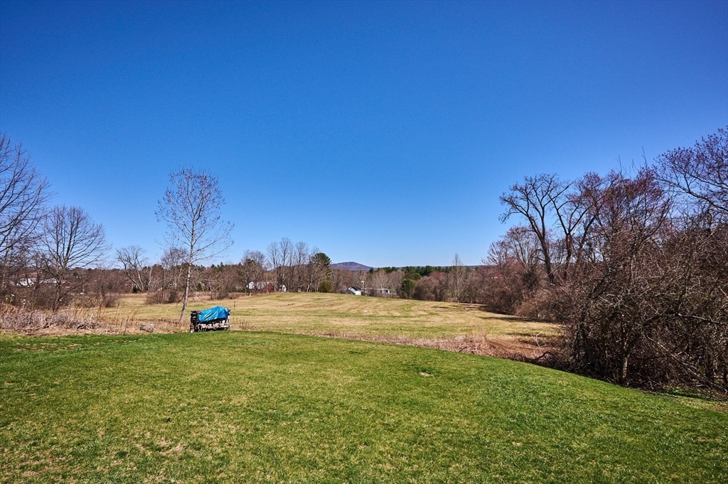 69 High Street Southampton, MA 01073 - Photo 32 of 40 a view of a field with trees in the background