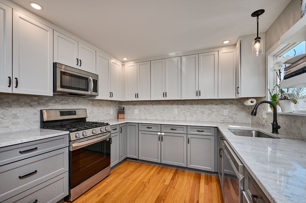 69 High Street Southampton, MA 01073 - Photo 10 of 40 a kitchen with granite countertop cabinets stainless steel appliances and a sink