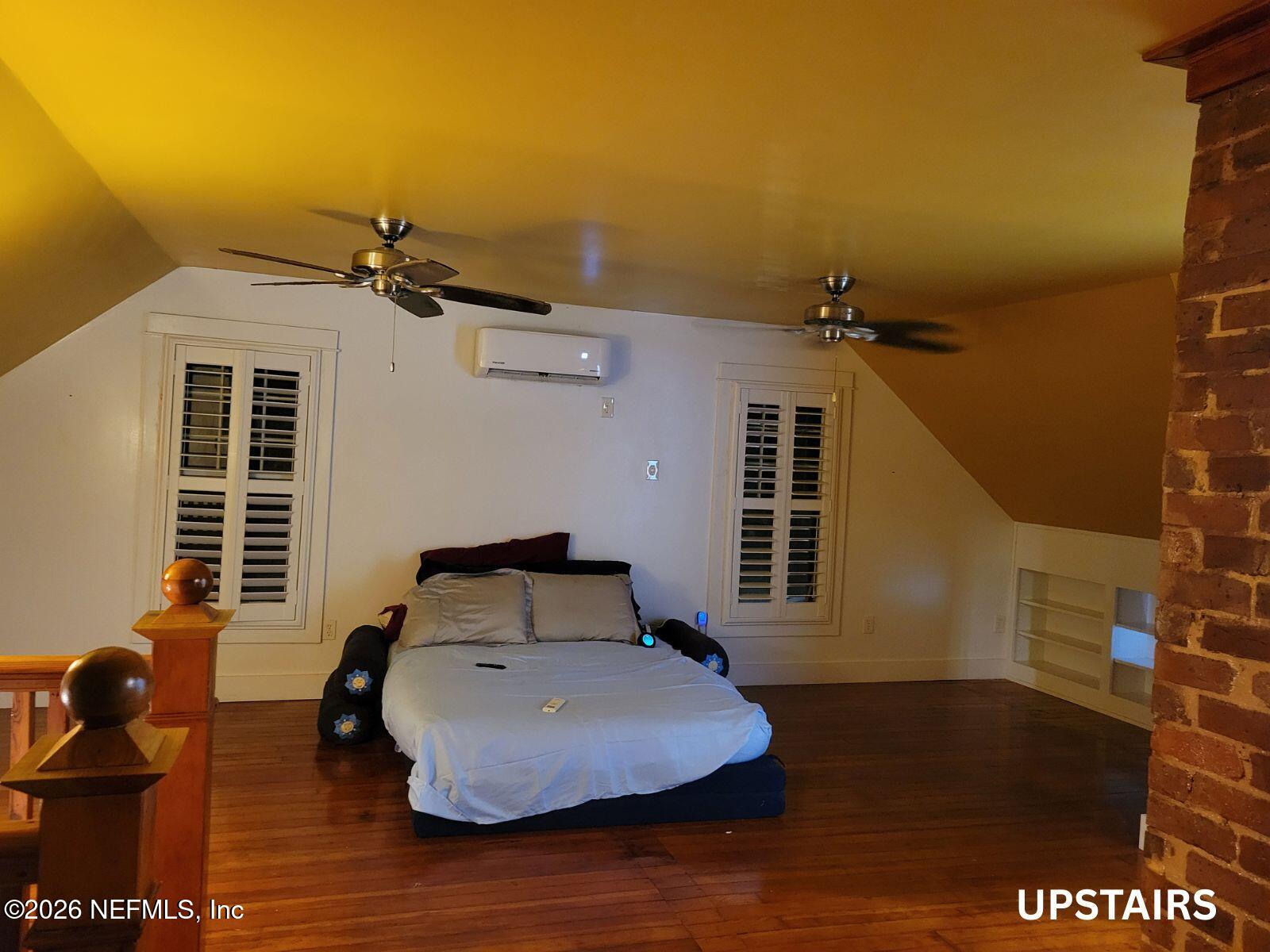 216 Summit Street Crescent City, FL 32112 - Photo 12 of 46 a bedroom with a bed and wooden floor
