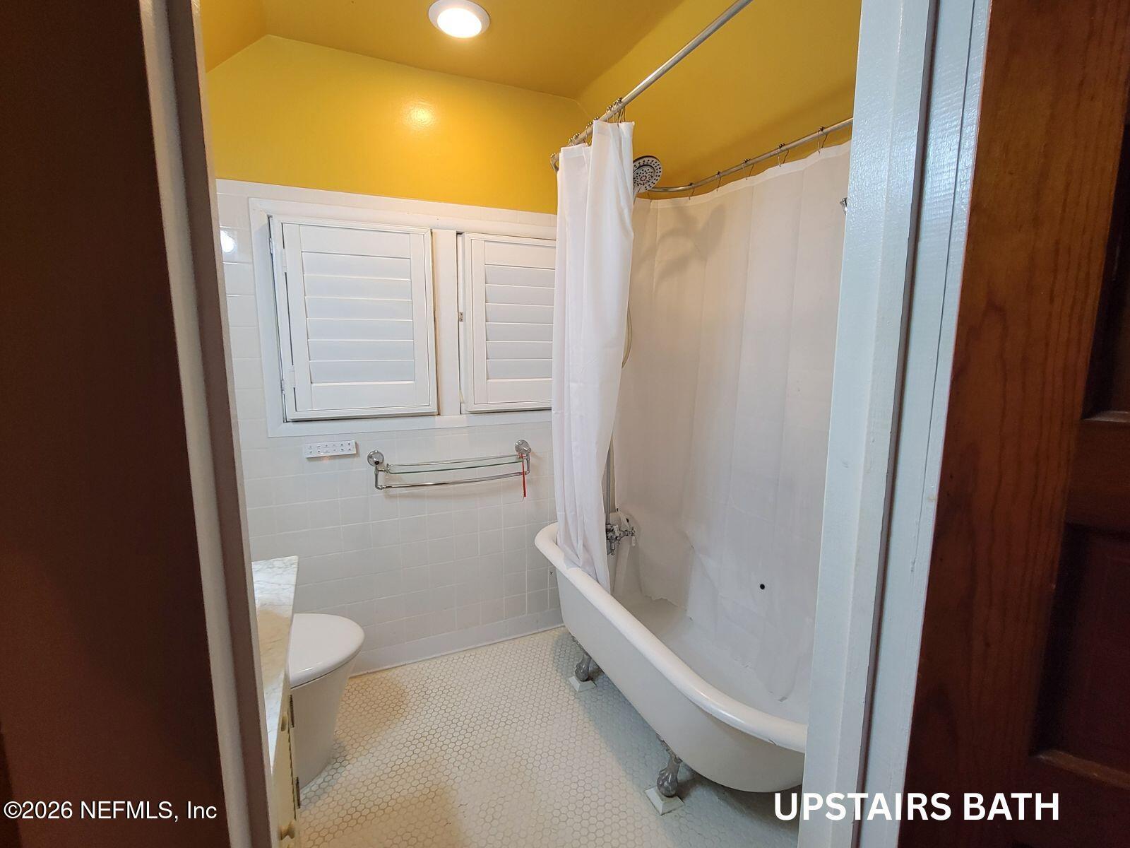 216 Summit Street Crescent City, FL 32112 - Photo 17 of 46 a bathroom with a bathtub and a shower