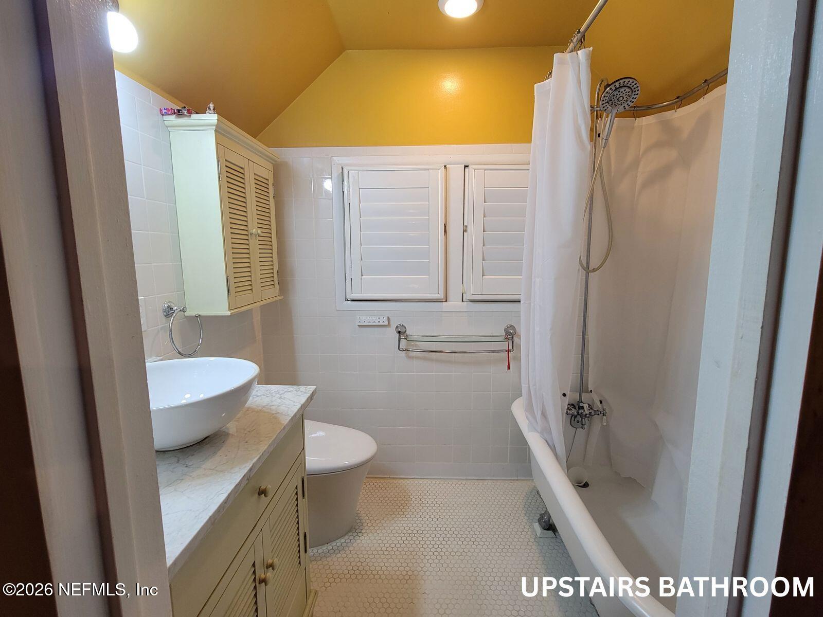 216 Summit Street Crescent City, FL 32112 - Photo 18 of 46 a bathroom with a granite countertop sink toilet and shower