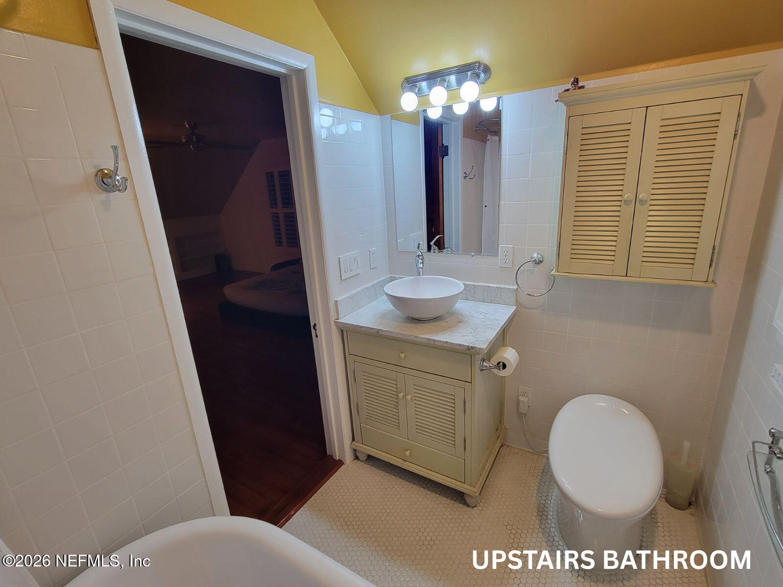 216 Summit Street Crescent City, FL 32112 - Photo 19 of 46 a bathroom with a sink a toilet and mirror