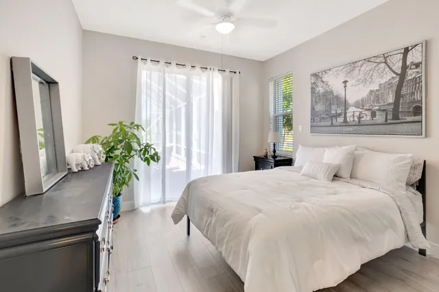 a bed room with a bed and a television