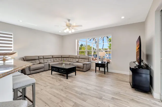 a view of a backyard with sitting area and furniture