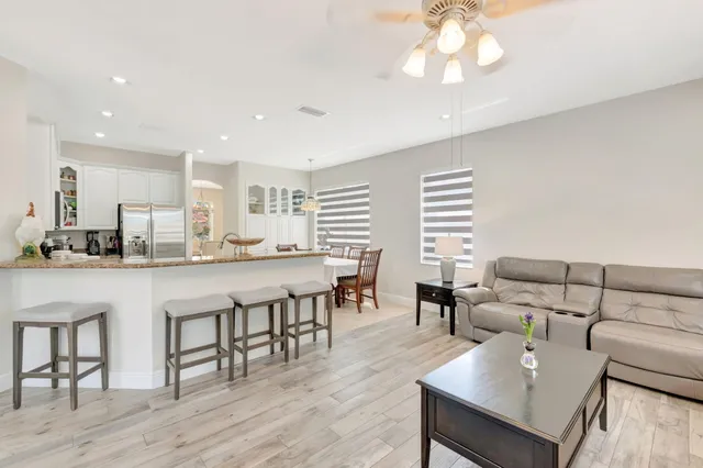 a view of a lake with houses in the back