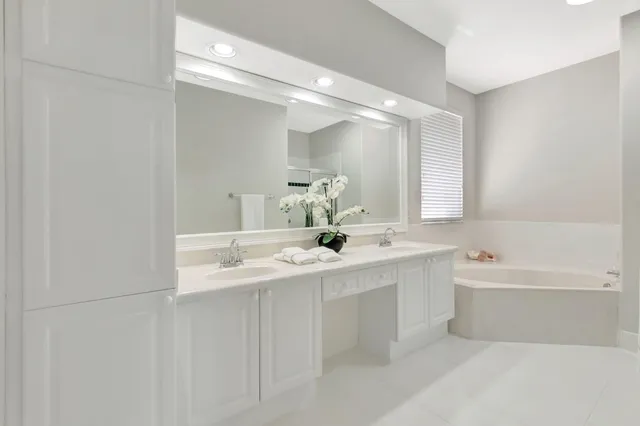 a view of a lake with houses in the background