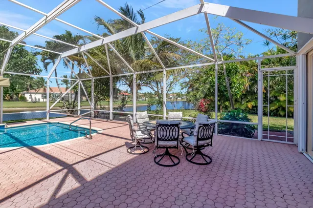a view of a lake with houses in the back