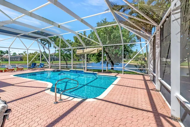 a kitchen with stainless steel appliances granite countertop a refrigerator and a stove