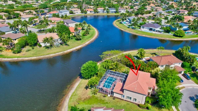 a front view of a house with yard and green space