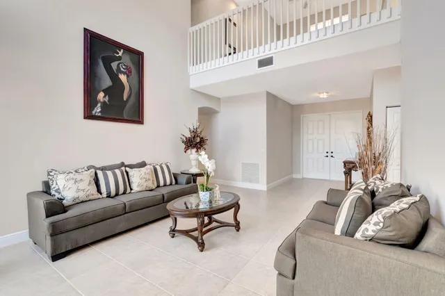 a view of a dining room with furniture wooden floor and chandelier
