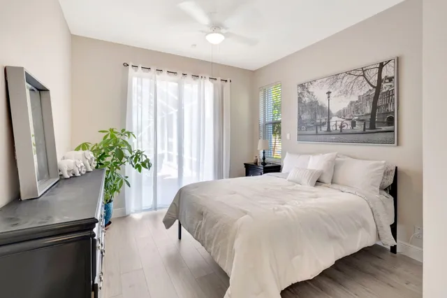 a view of a livingroom with workspace and a window