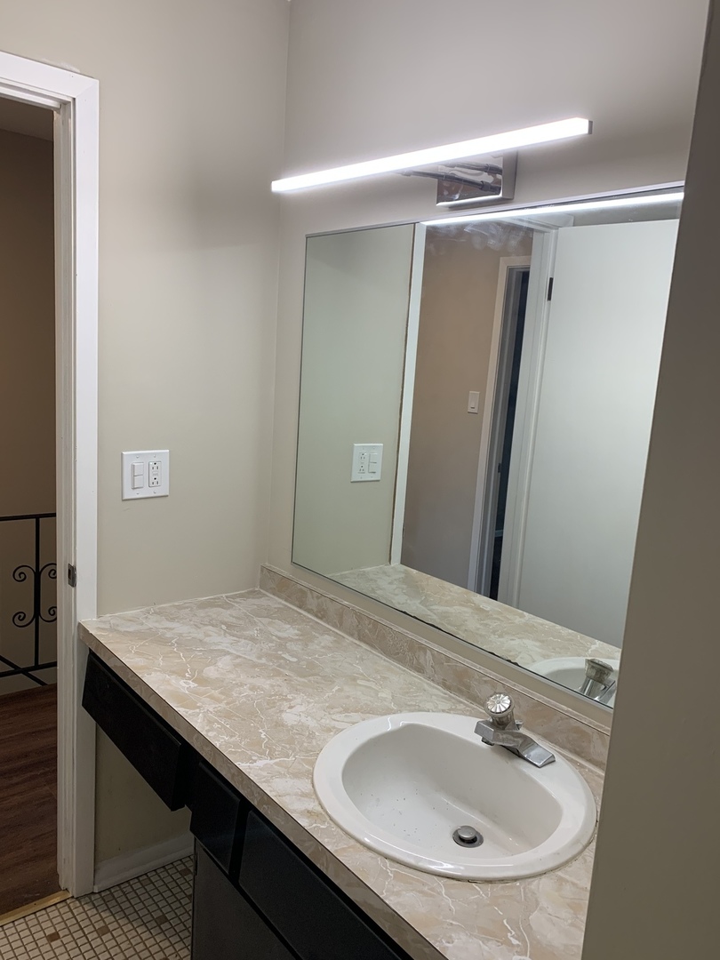 923 LaGrange Road La Grange, IL 60525 - Photo 14 of 22 a bathroom with a sink and a mirror