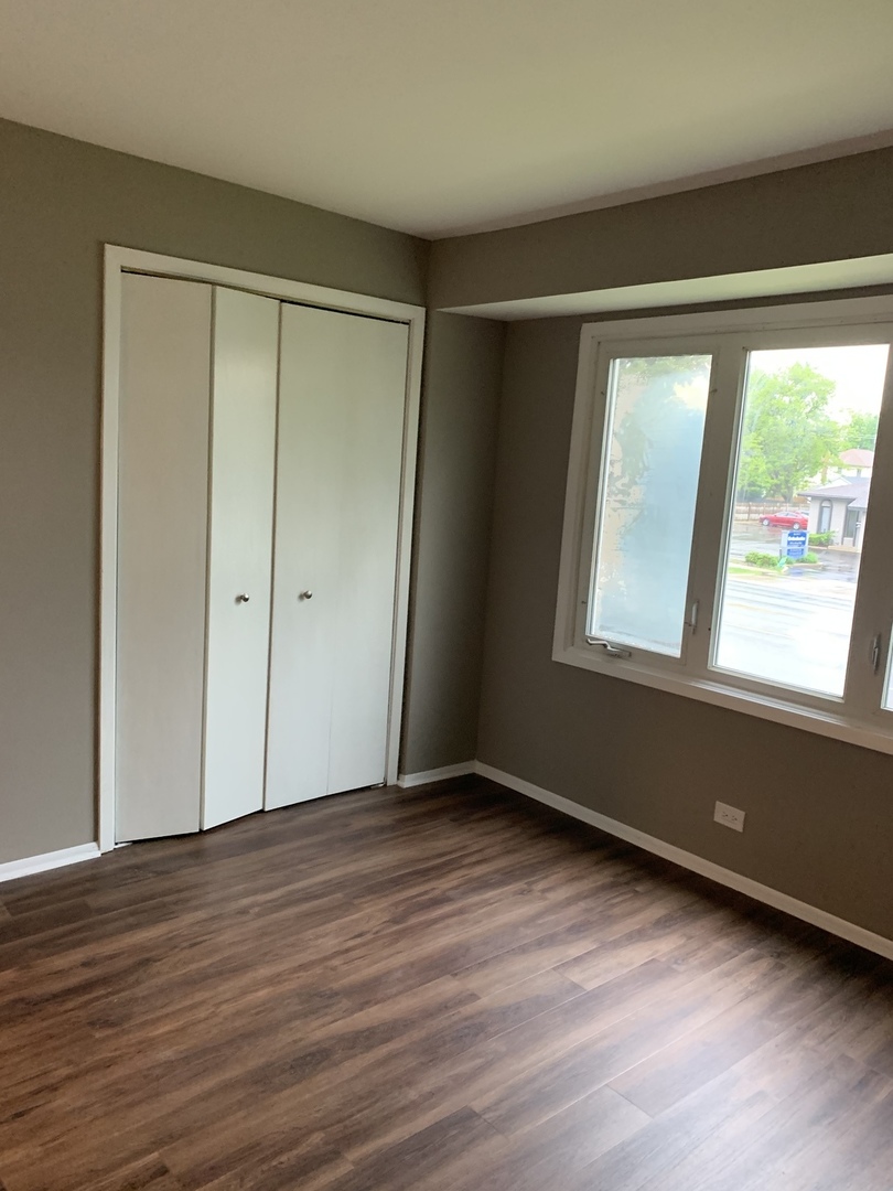 923 LaGrange Road La Grange, IL 60525 - Photo 15 of 22 a view of an empty room with wooden floor and a window
