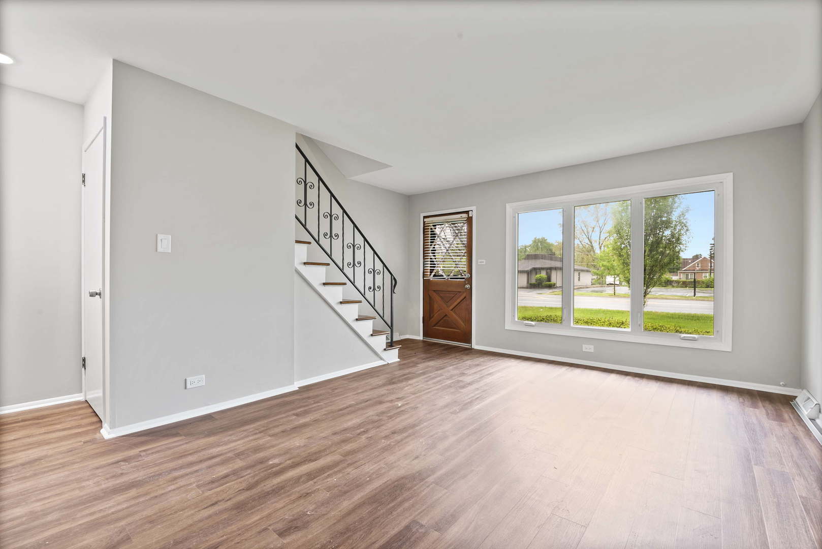 923 LaGrange Road La Grange, IL 60525 - Photo 3 of 22 a view of an empty room with wooden floor and a window