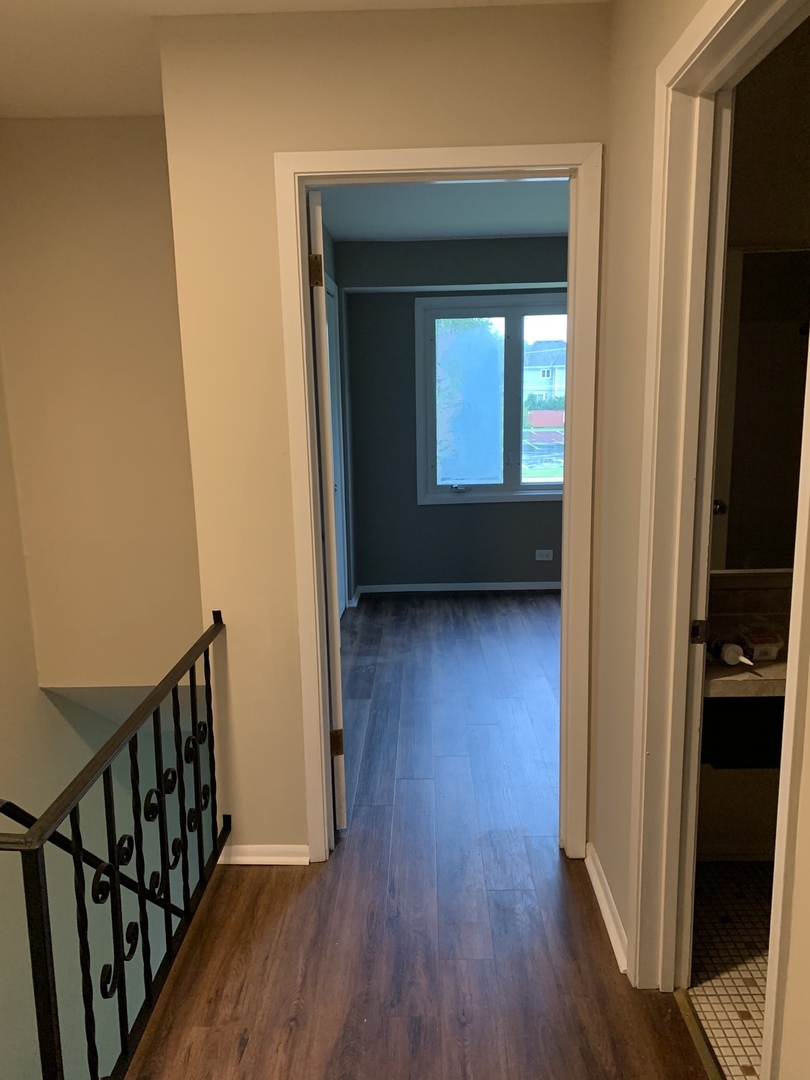 923 LaGrange Road La Grange, IL 60525 - Photo 7 of 22 a view of a hallway with wooden floor and a window