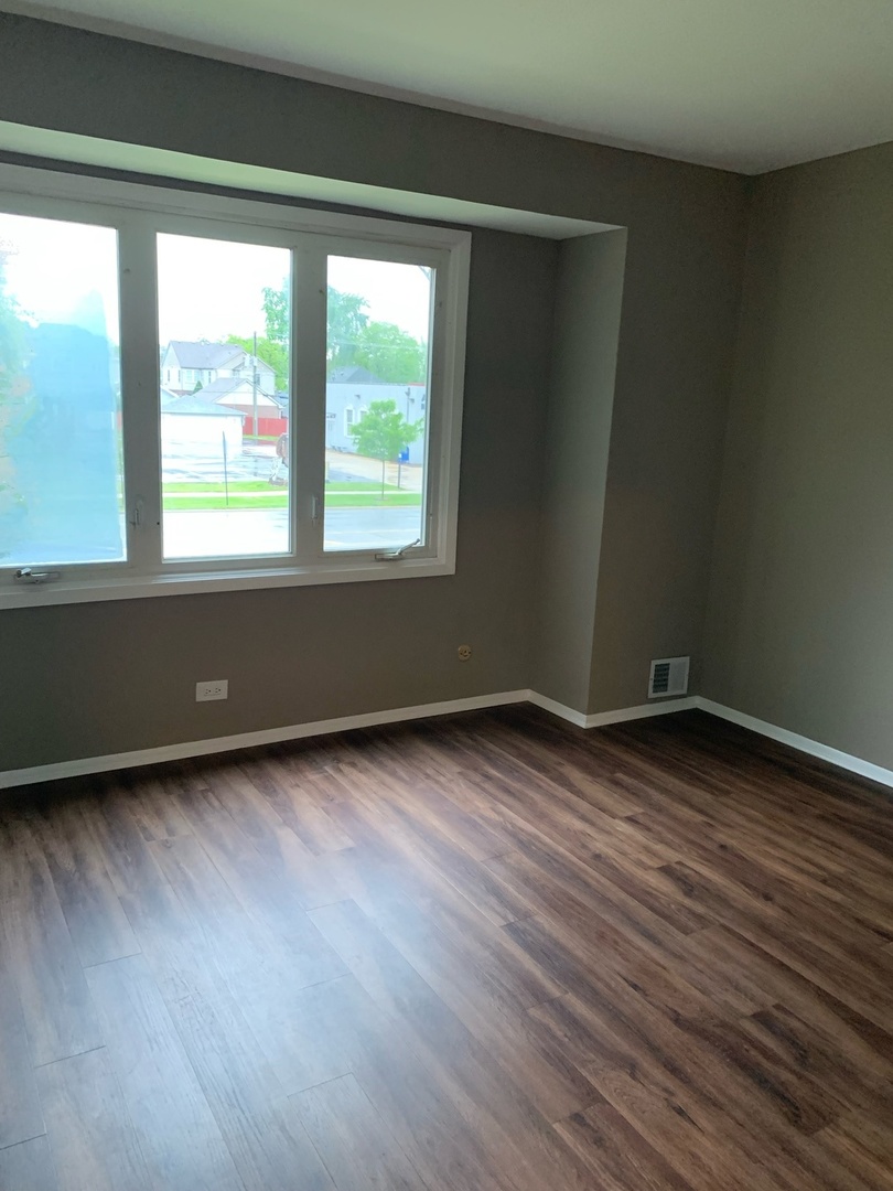 923 LaGrange Road La Grange, IL 60525 - Photo 8 of 22 a view of wooden floor and windows in a room
