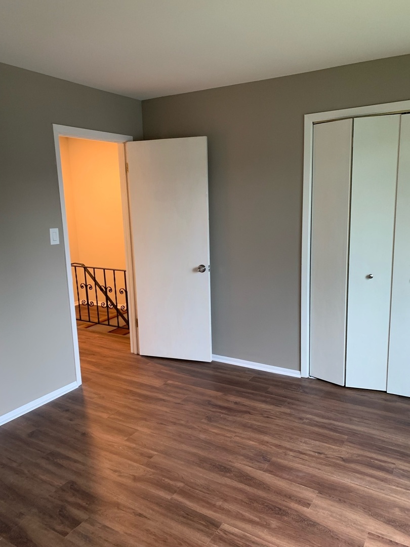 923 LaGrange Road La Grange, IL 60525 - Photo 9 of 22 a view of an empty room with wooden floor and a window