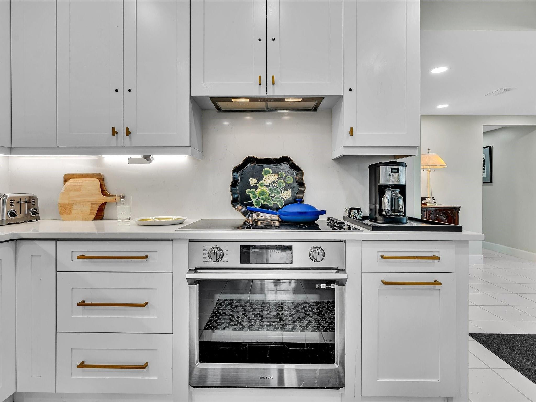 7642 Elm Ridge Drive, Unit 14L Boca Raton, FL 33433 - Photo 14 of 69 a kitchen with a stove and cabinets