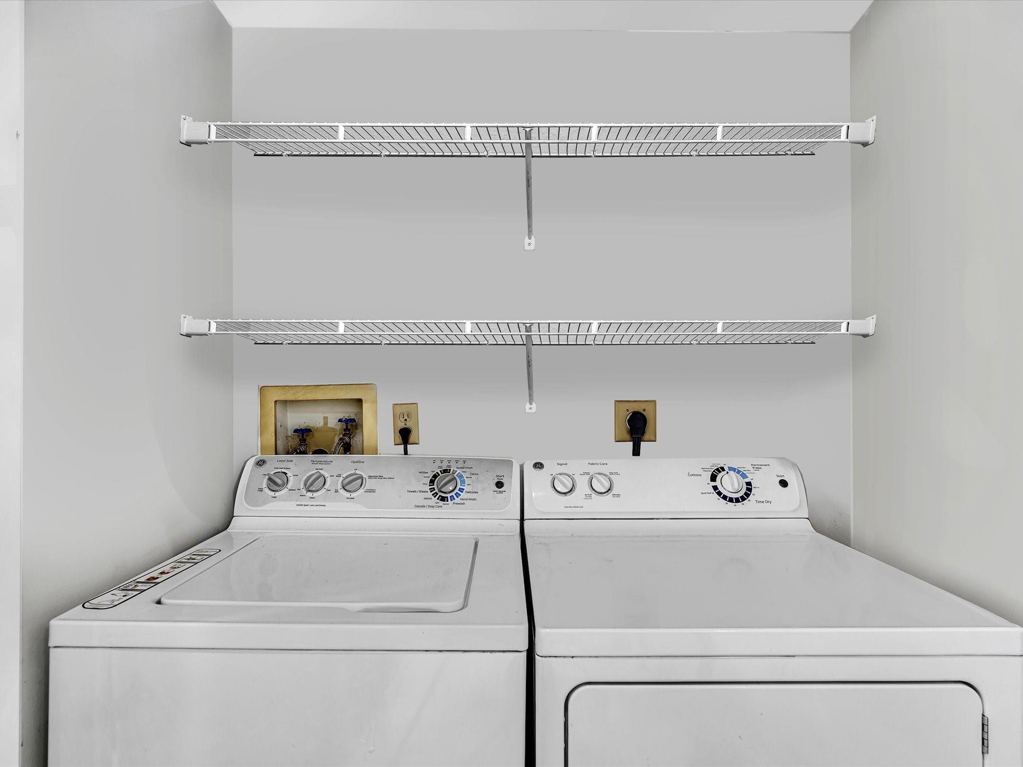 7642 Elm Ridge Drive, Unit 14L Boca Raton, FL 33433 - Photo 22 of 69 a utility room with dryer and washer