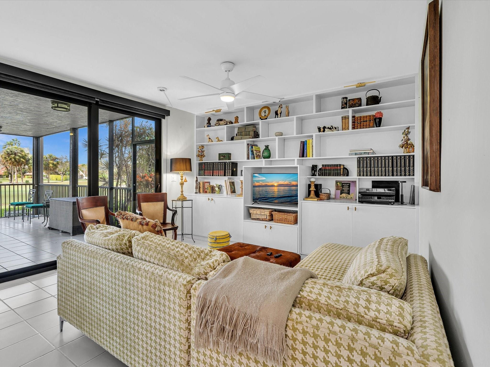 7642 Elm Ridge Drive, Unit 14L Boca Raton, FL 33433 - Photo 24 of 69 a bedroom with furniture and a large window