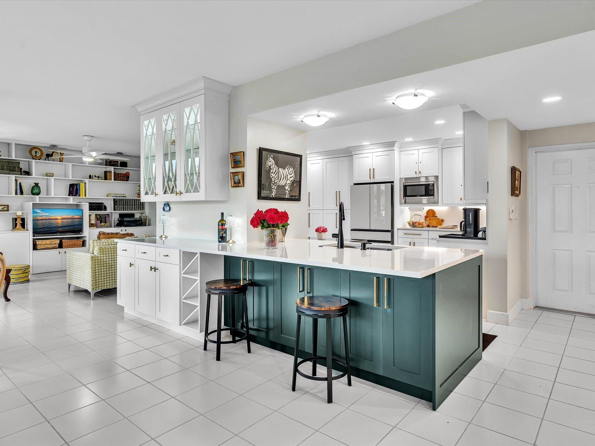 7642 Elm Ridge Drive, Unit 14L Boca Raton, FL 33433 - Photo 28 of 69 a kitchen with a sink cabinets and counter space