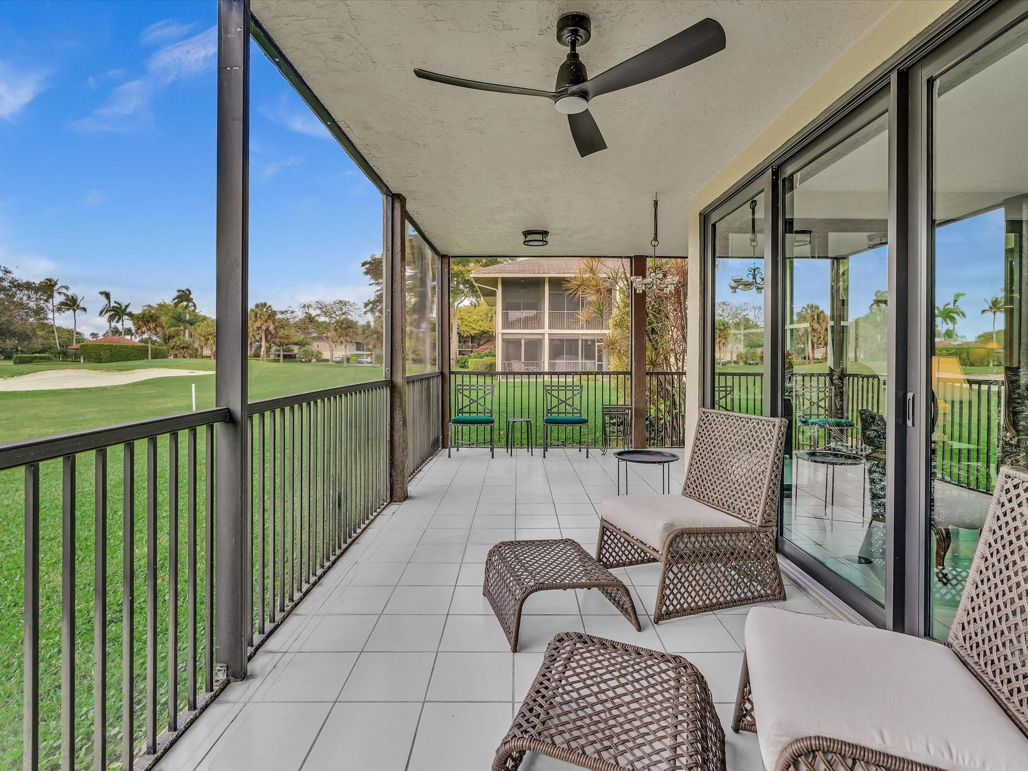 7642 Elm Ridge Drive, Unit 14L Boca Raton, FL 33433 - Photo 32 of 69 a balcony with furniture and a potted plant