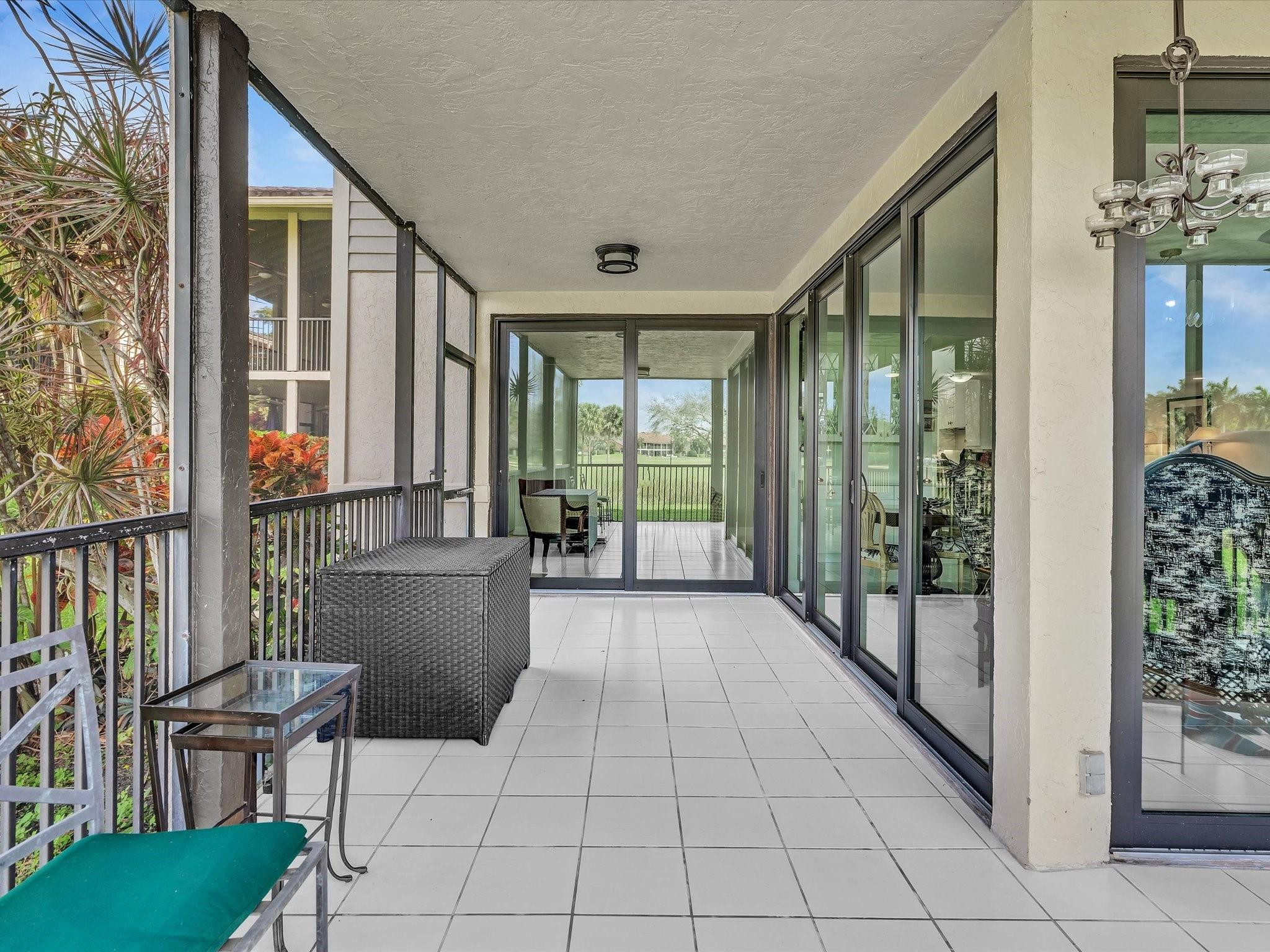 7642 Elm Ridge Drive, Unit 14L Boca Raton, FL 33433 - Photo 35 of 69 a lobby with furniture and floor to ceiling window