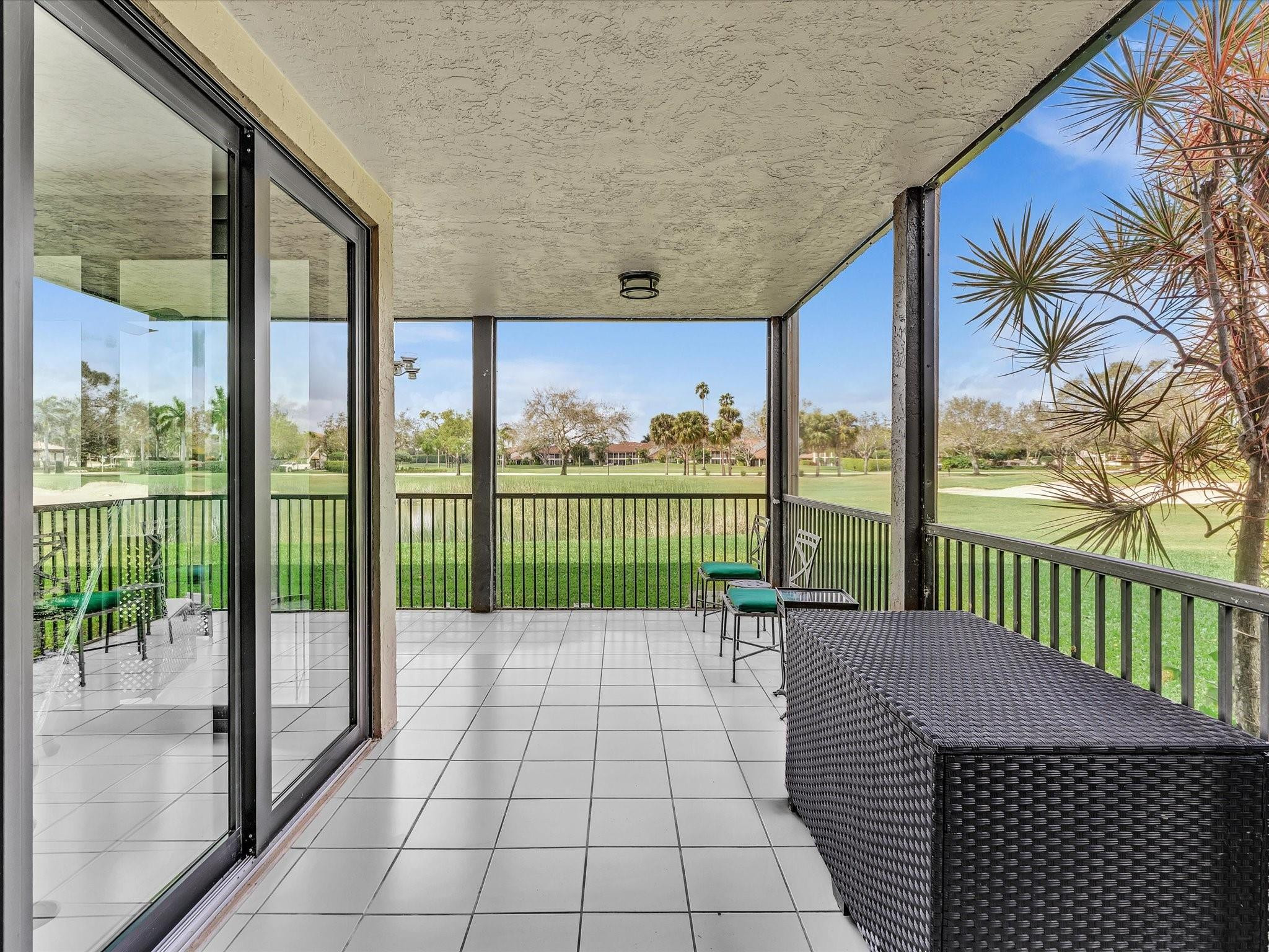 7642 Elm Ridge Drive, Unit 14L Boca Raton, FL 33433 - Photo 37 of 69 a view of a balcony with a swing