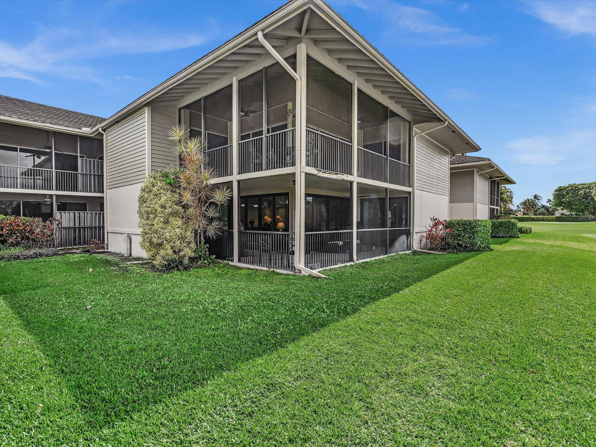 7642 Elm Ridge Drive, Unit 14L Boca Raton, FL 33433 - Photo 41 of 69 a view of house with backyard