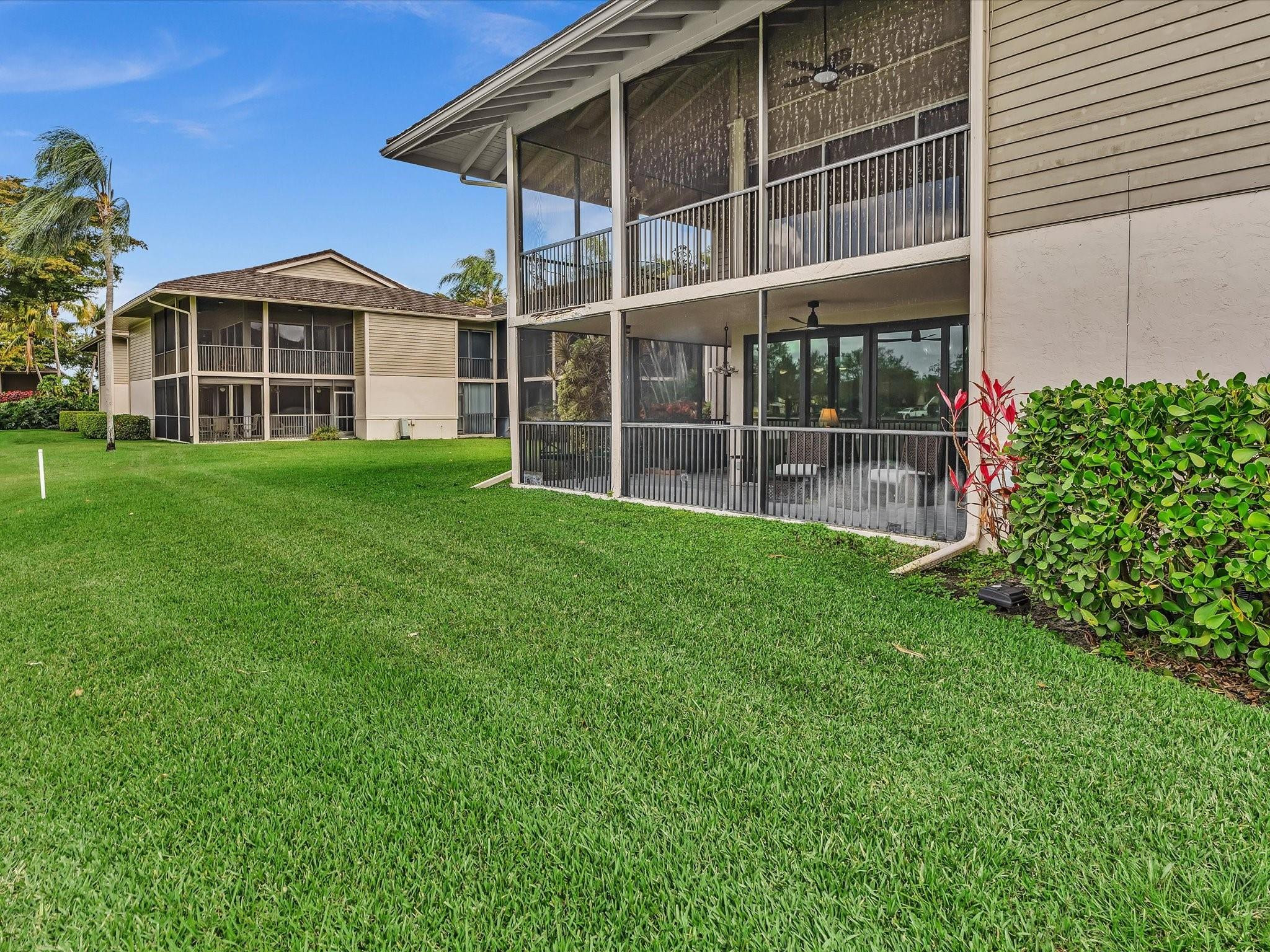 7642 Elm Ridge Drive, Unit 14L Boca Raton, FL 33433 - Photo 43 of 69 a view of a house with a yard and sitting area
