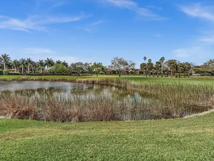 a view of a golf course with a lake
