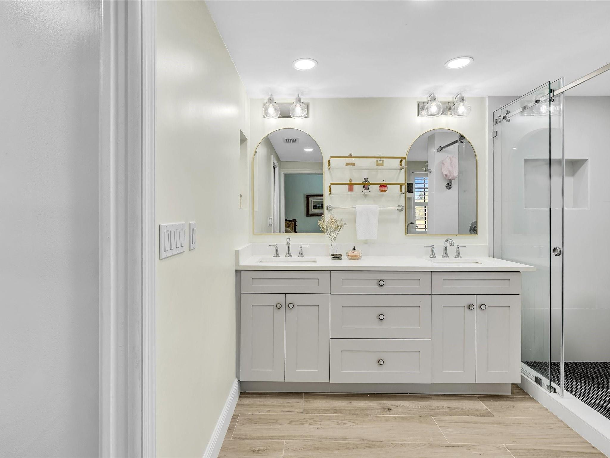 7642 Elm Ridge Drive, Unit 14L Boca Raton, FL 33433 - Photo 50 of 69 a bathroom with a double vanity sink mirror and double