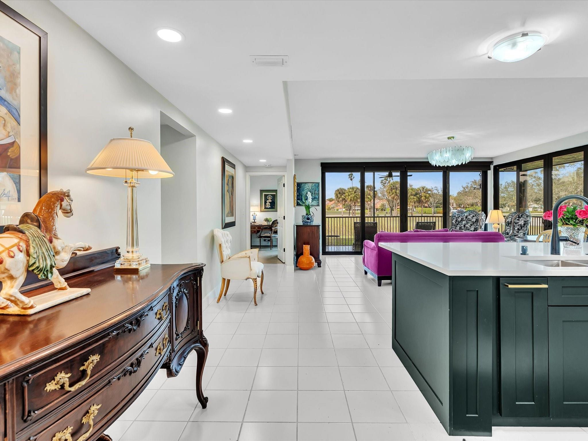 7642 Elm Ridge Drive, Unit 14L Boca Raton, FL 33433 - Photo 5 of 69 a group of people sitting in a kitchen