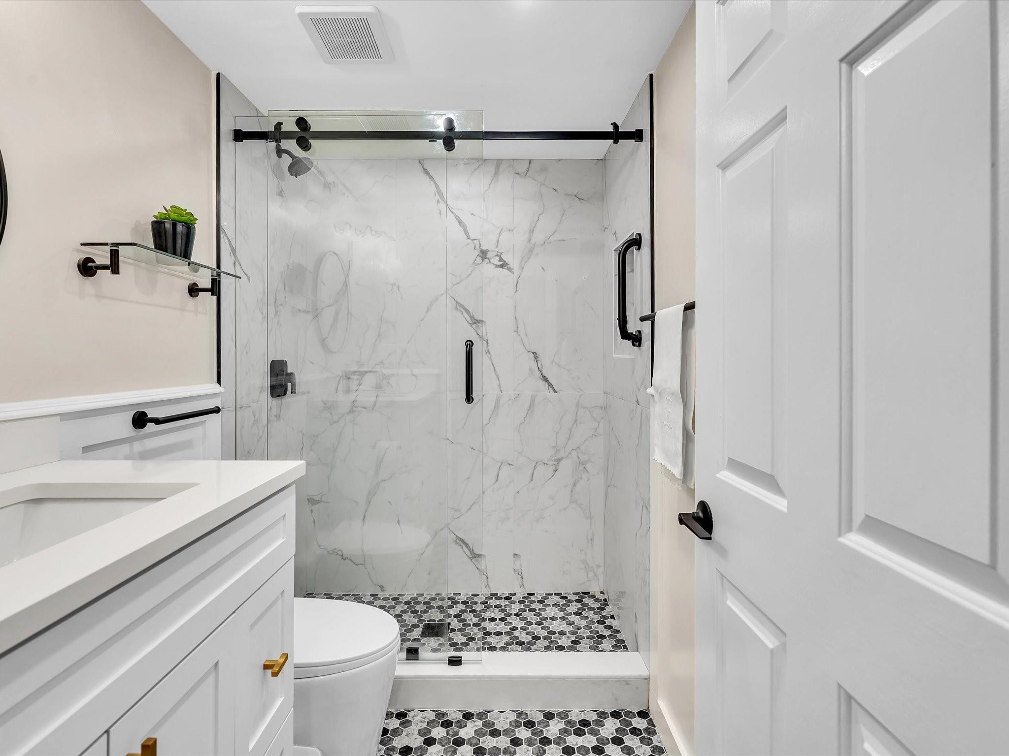 7642 Elm Ridge Drive, Unit 14L Boca Raton, FL 33433 - Photo 55 of 69 a bathroom with a sink a toilet and shower