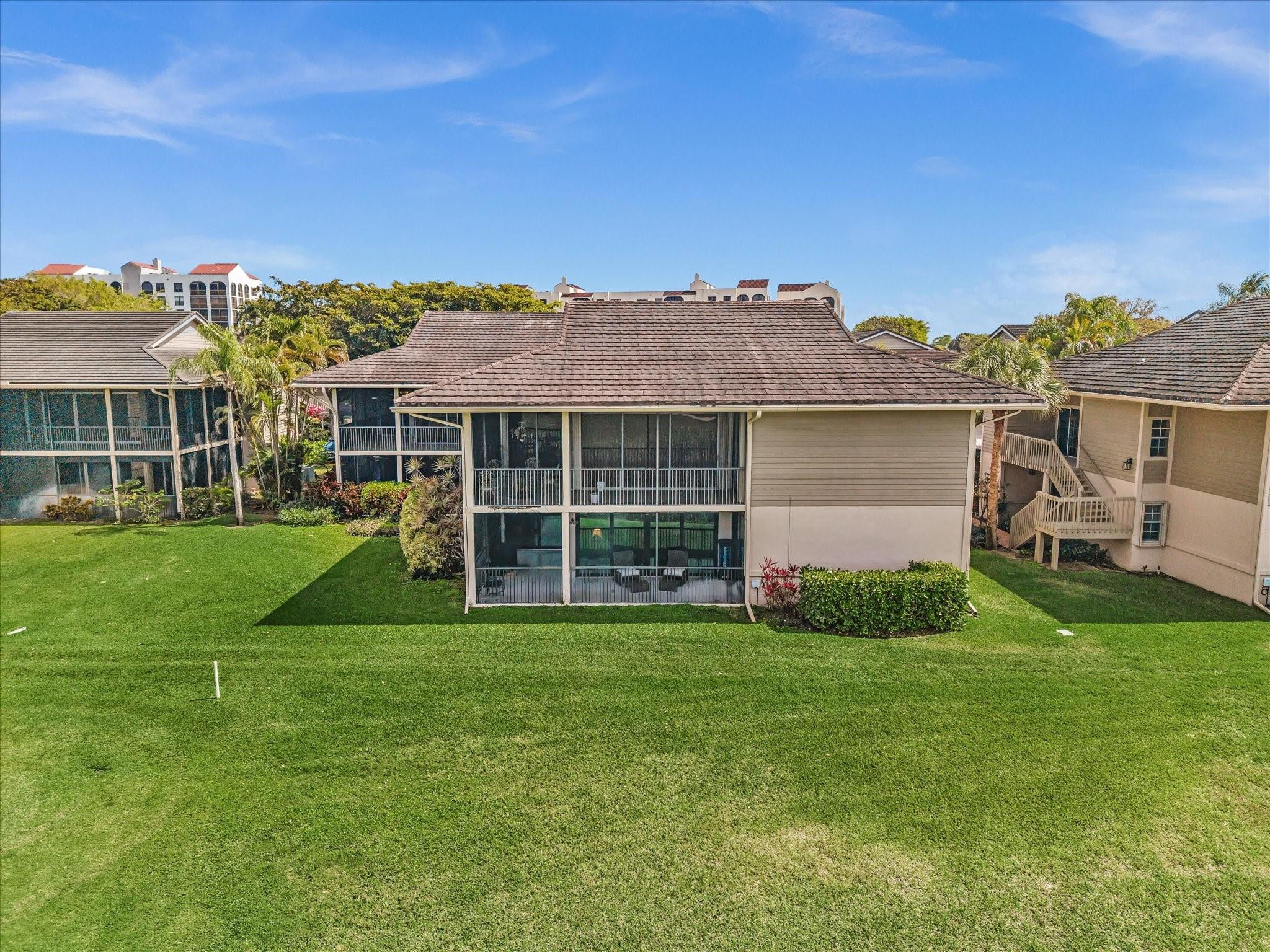 7642 Elm Ridge Drive, Unit 14L Boca Raton, FL 33433 - Photo 65 of 69 a view of a house with a backyard