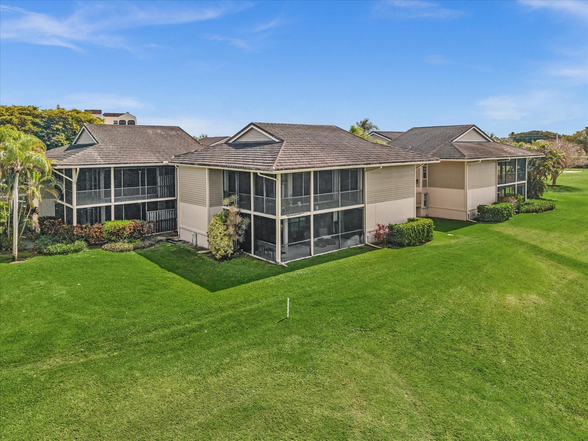 7642 Elm Ridge Drive, Unit 14L Boca Raton, FL 33433 - Photo 66 of 69 a view of a house with a yard and sitting area