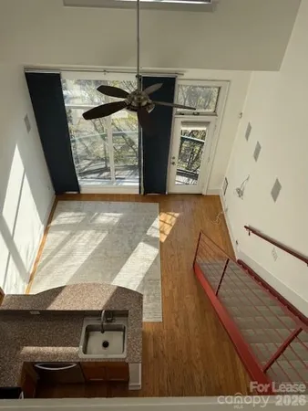 a kitchen with a sink and large window