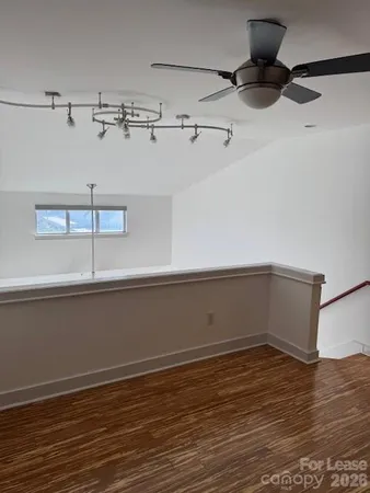 a kitchen with stainless steel appliances a refrigerator and a stove top oven