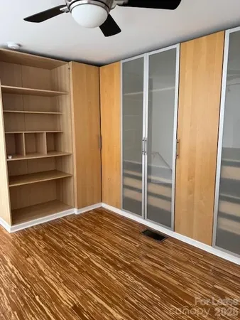 a kitchen with a sink a microwave a refrigerator and cabinets