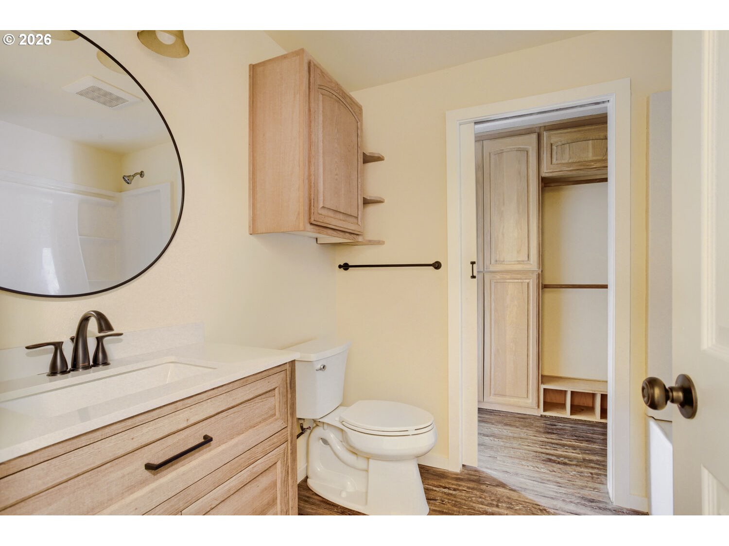 14539 Southeast Center Street Portland, OR 97236 - Photo 16 of 30 a bathroom with a sink a toilet and a mirror