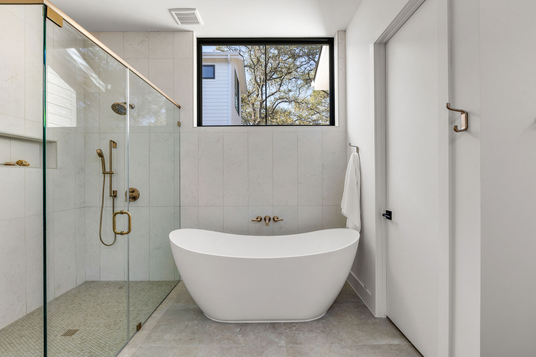 8307 Silver Ridge Drive Austin, TX 78759 - Photo 16 of 27 Full bath with a shower stall, a soaking tub, and tile walls