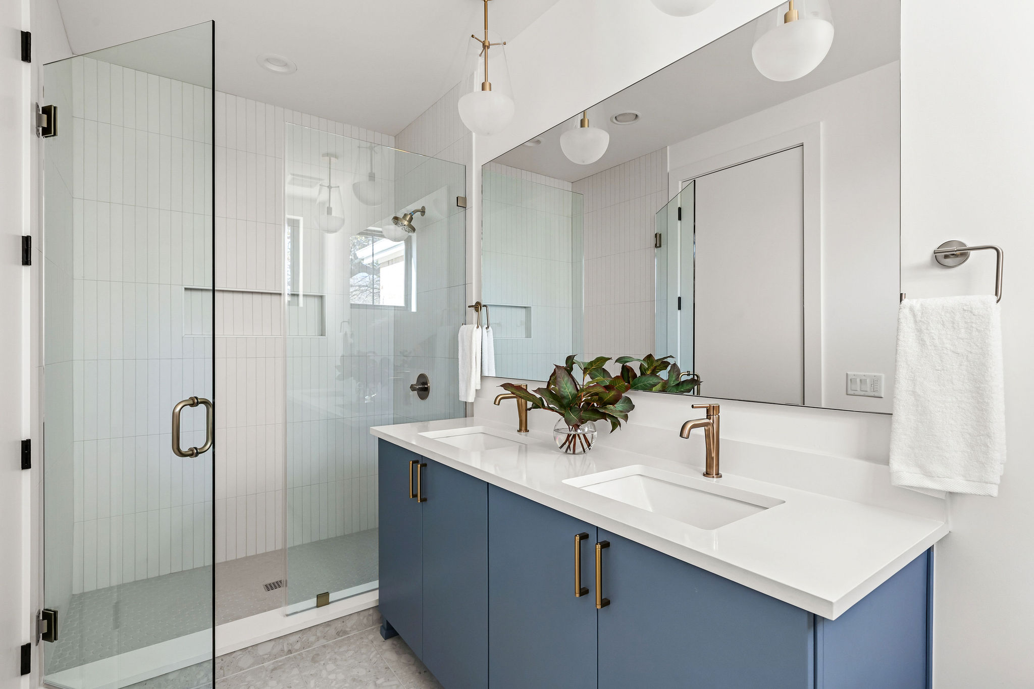 8307 Silver Ridge Drive Austin, TX 78759 - Photo 21 of 27 Full bath with a stall shower, double vanity, and light tile patterned flooring