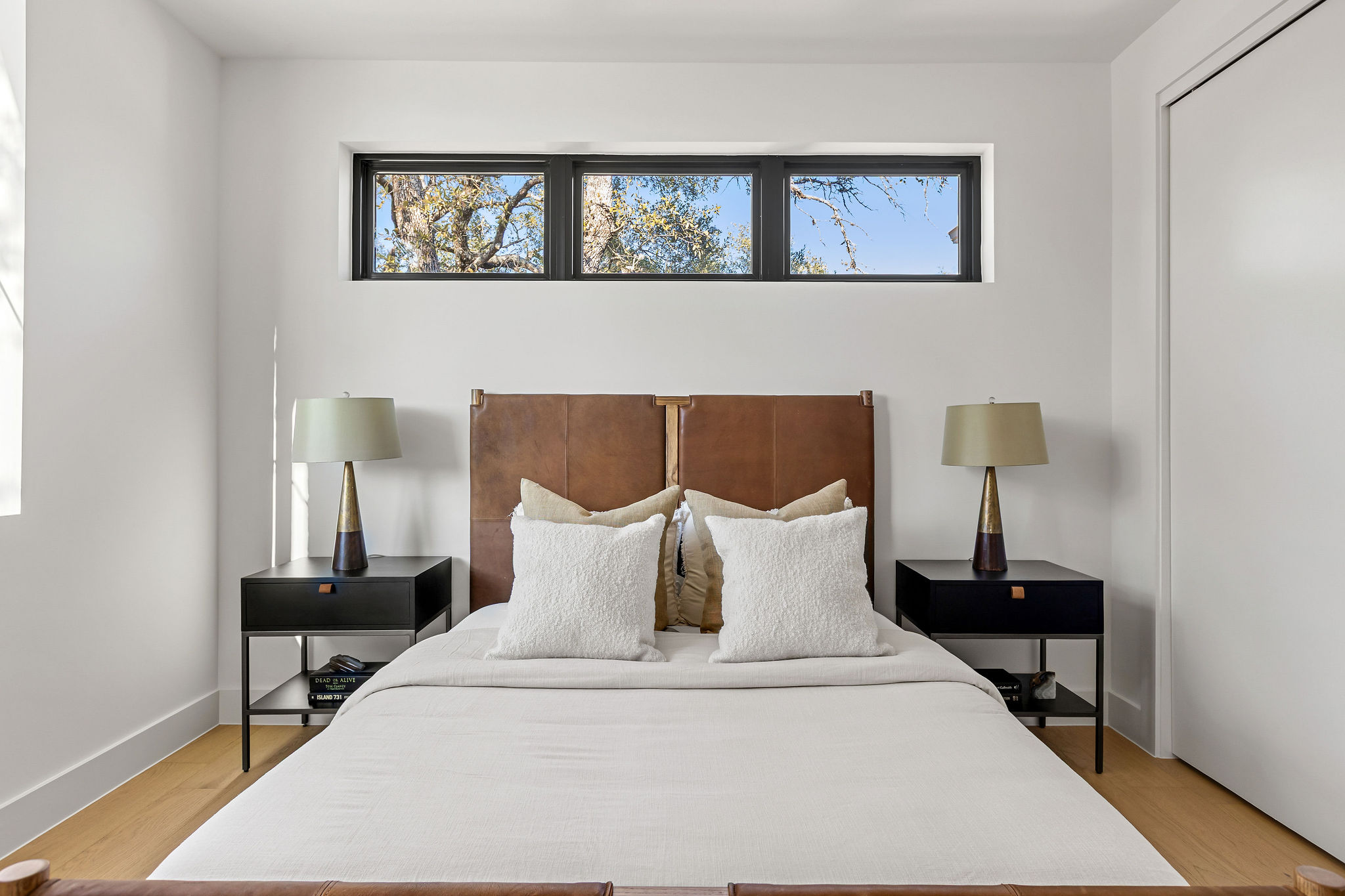 8307 Silver Ridge Drive Austin, TX 78759 - Photo 22 of 27 Bedroom featuring light wood finished floors and baseboards