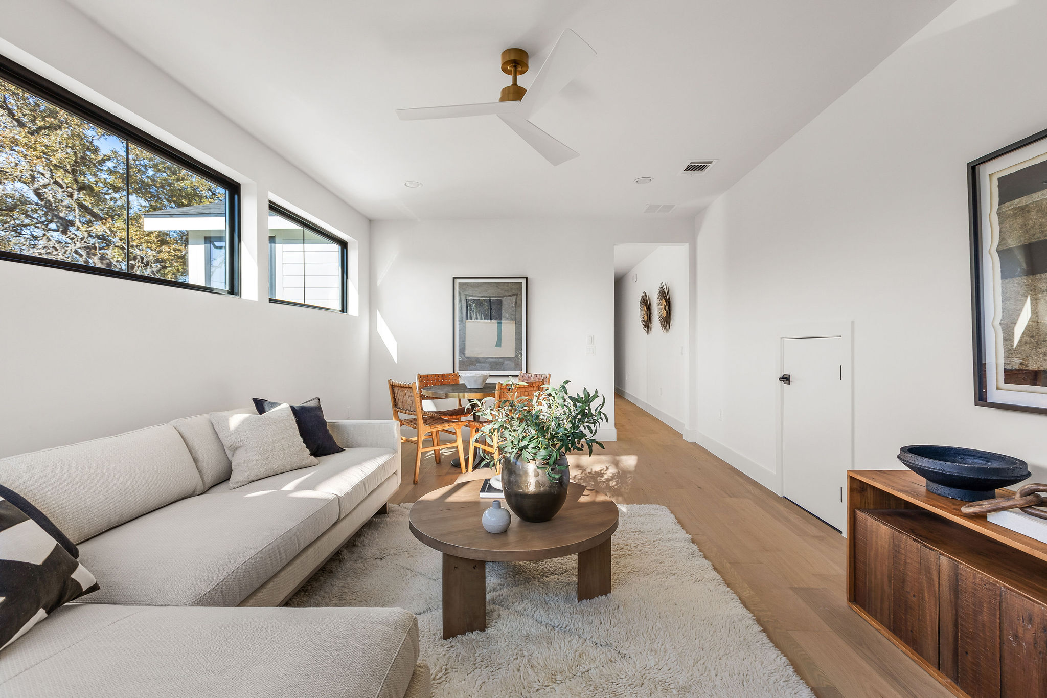 8307 Silver Ridge Drive Austin, TX 78759 - Photo 24 of 27 Living room with wood finished floors and a ceiling fan