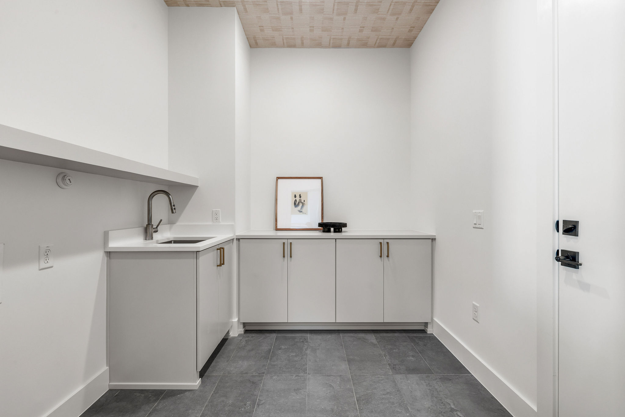 8307 Silver Ridge Drive Austin, TX 78759 - Photo 26 of 27 Laundry area featuring baseboards and cabinet space