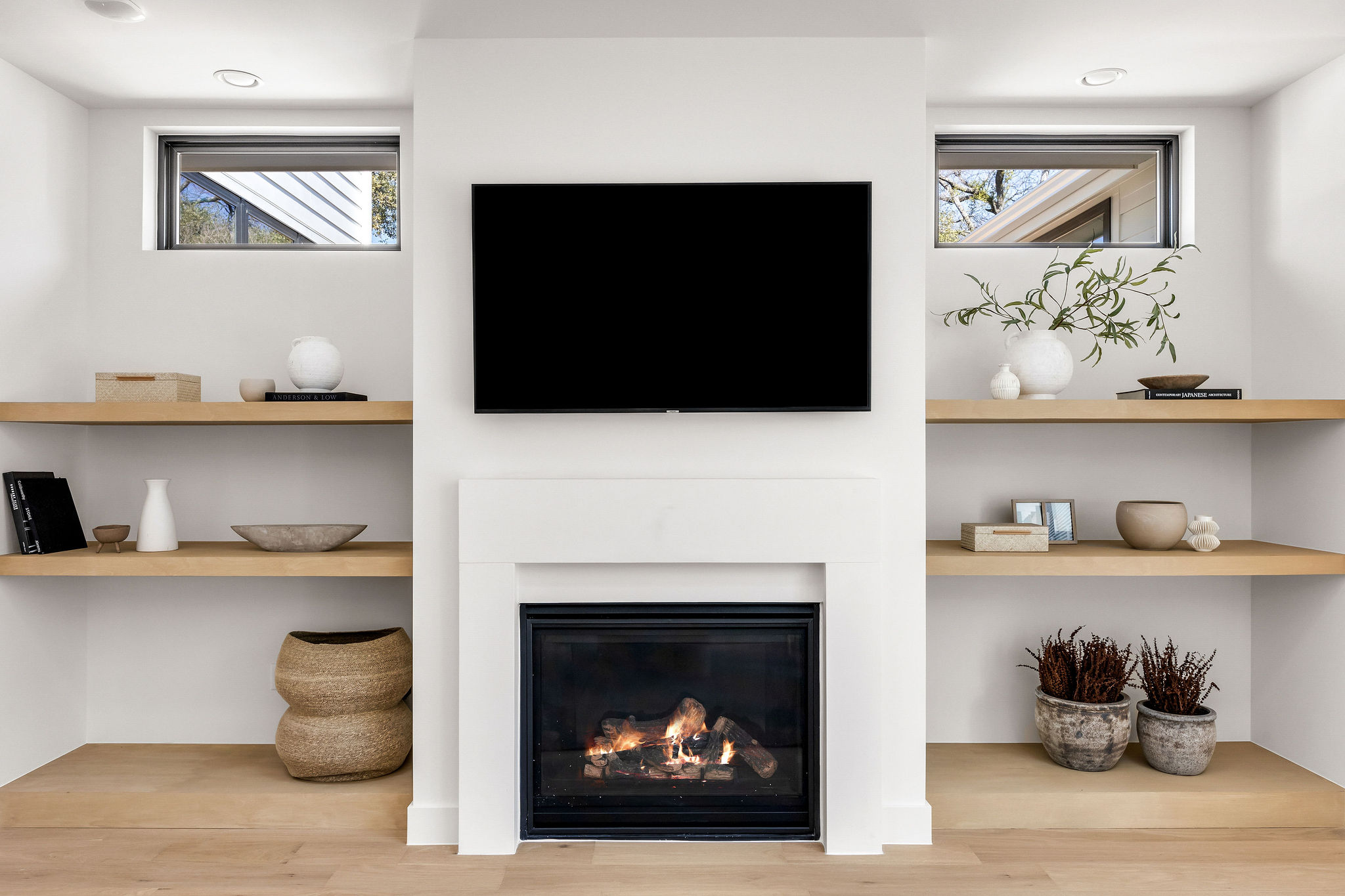 8307 Silver Ridge Drive Austin, TX 78759 - Photo 5 of 27 Detailed view of wood finished floors and a glass covered fireplace