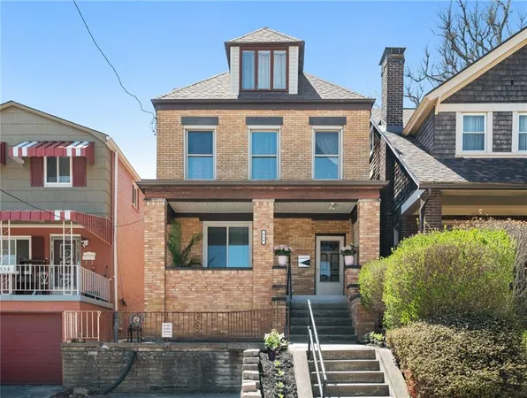 a front view of a house with glass windows