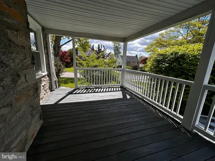 a view of a two chairs in the balcony