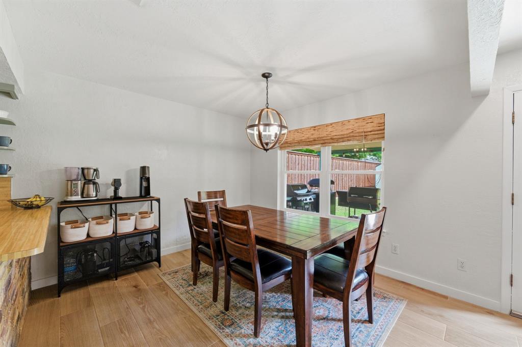 224 Overcrest Drive Benbrook, TX 76126 - Photo 10 of 39 a view of a dining room with furniture window and wooden floor