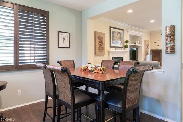 a view of a dining room with furniture and window